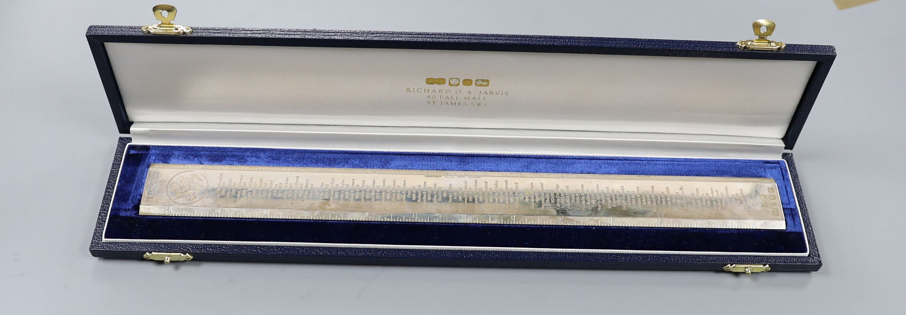 A cased modern silver 'Presidents Rule' ruler, engraved with the names and dates of US Presidents, by Richard Jarvis, London, 2004, 10oz